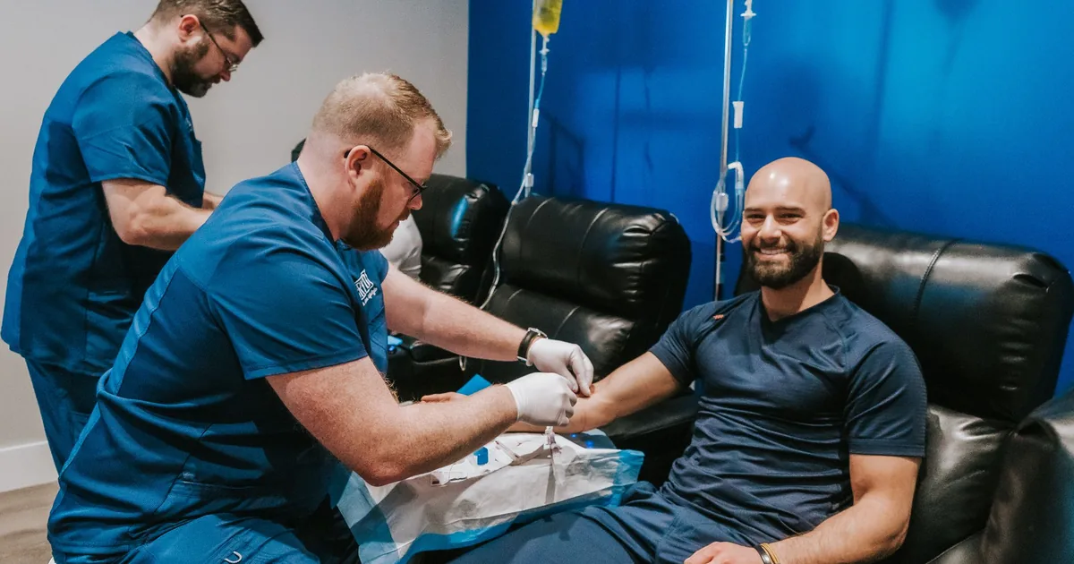 Client relaxing during an IV vitamin drip at iCRYO Daniel Island in Charleston, SC