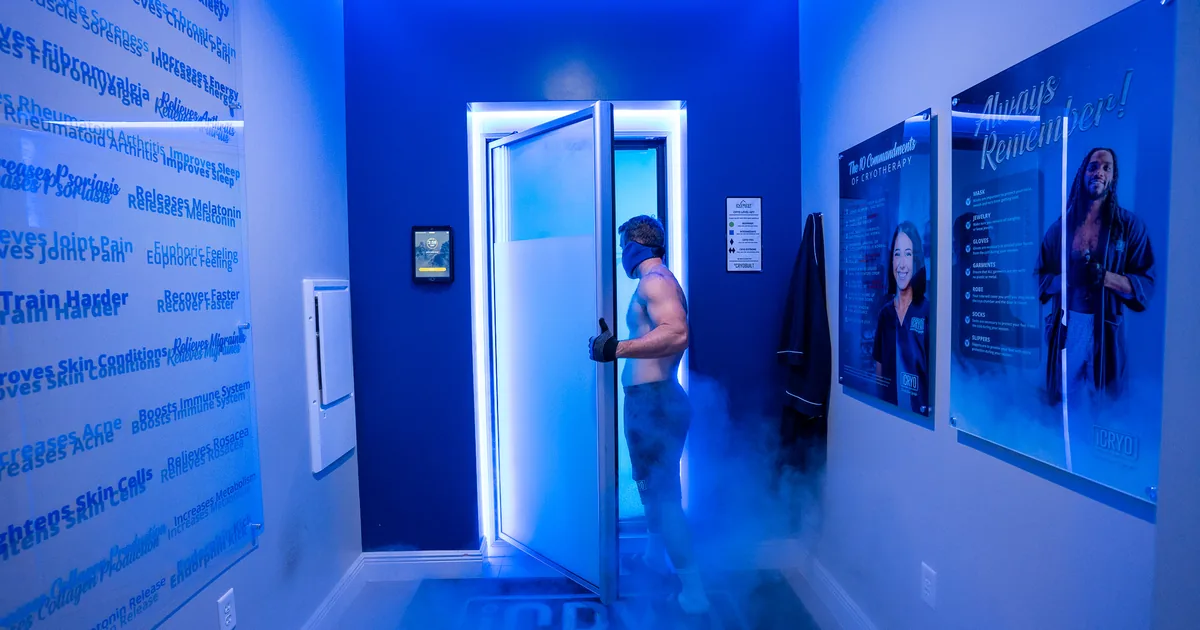 Client in a whole-body cryotherapy chamber with cold vapor at iCRYO Daniel Island in Charleston, SC